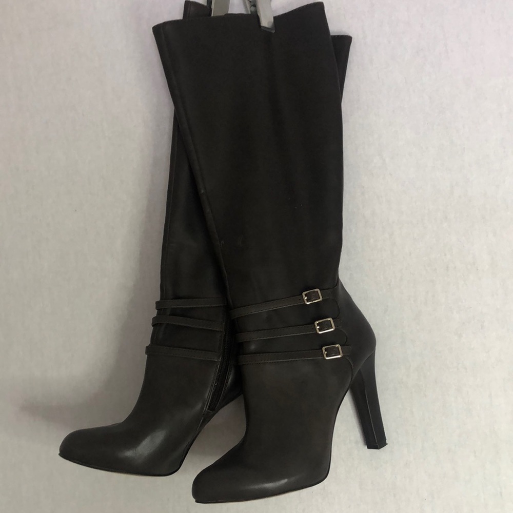 Women’s brown faux leather boots in a size 8 1/2 with a 4 inch heel.